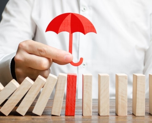 Lifetime Capital Gains Exemption - umbrella protecting dominos
